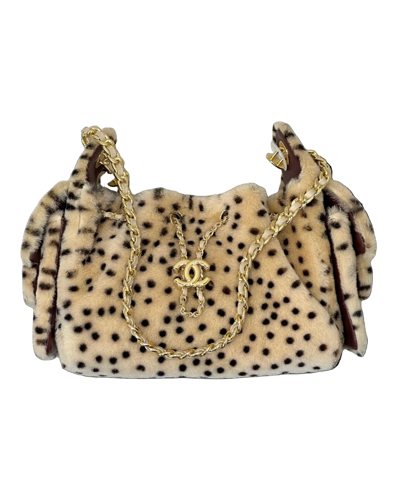A plush faux-fur shoulder bag in a beige and black leopard print pattern, featuring a gold-tone chain strap and a gold interlocking CC logo clasp, set against a plain white background.